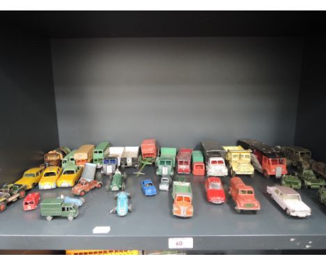 A shelf of playworn diecasts including Dinky, Corgi, Lesney etc including Dinky Renault Dauphine Mini cab with decals, Corgi 