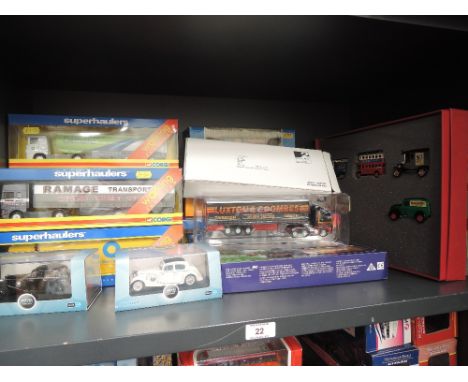 A shelf of modern diecast articulated wagons and cars including Corgi, Oxford, Lledo etc including The Raleigh Boxed Set, all