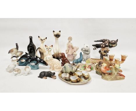 Spanish porcelain figure&nbsp;of a suited ballet dancer, a Nao porcelain seated bear, a pair of Poole pottery dolphins and a 