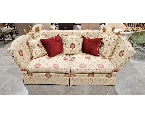 Knole drop-end sofa by Brights of Nettlebed, upholstered in a floral scrolling fabric on a cream ground with five matching cu