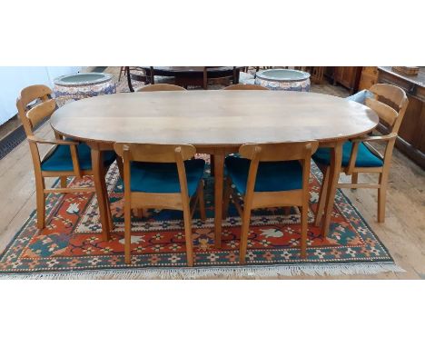 1969/1970 Oliver Morel Cotswold School walnut oval dining table and chairs, the table having figured wood inlaid with ebony a