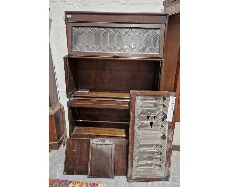 A mahogany Globe Wernicke style bookcase unit comprising three leaded glass glazed units over a single drawer, measuring appr