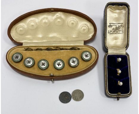 Three gold and pearl studs, cased, 3g approx. and a set of six gilt metal and enamel collar studs, cased 