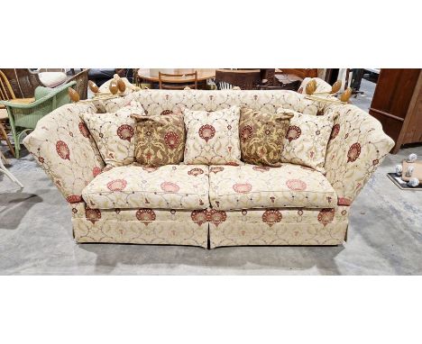 Knole drop-end sofa by Brights of Nettlebed, upholstered in a floral scrolling fabric on a cream ground with five matching cu