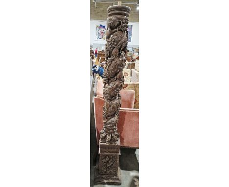 Heavily carved oak standard lamp base&nbsp;with grapevine and bird decoration, raised on a squared plinth base, 162cm high&nb