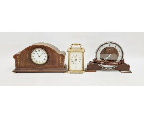 Early 20th century French mahogany mantel clock, the circular enamel dial with Roman numerals denoting hours, the front decor