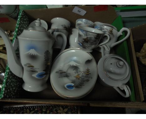 Small Chinese tea set with cups, saucers, milk, sugar and teapot