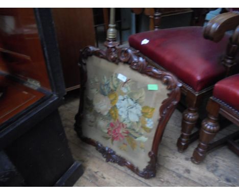 Victorian heavily carved pole stand, tripod base with woolwork fabric interior