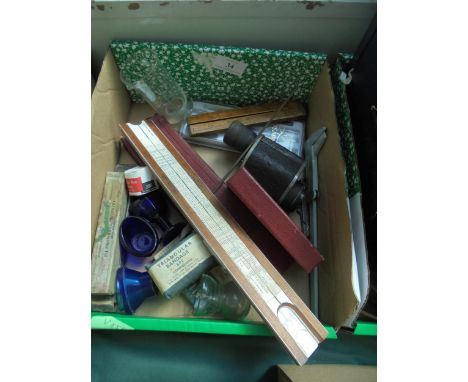 Mixed lot including old medical thermometers glassware, bandages together with monocular vintage rulers and including slide r