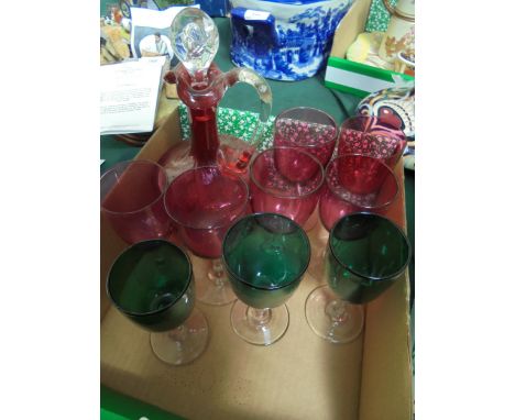 Cut glass cranberry decanter with 6 ruby glasses together with 3 green cranberry style glasses
