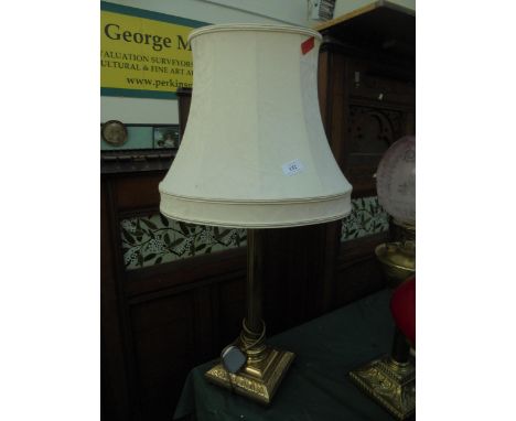 Modern heavy brass table lamp with cream shade