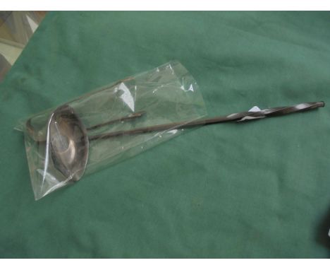 Unusual small unmarked silver ladle, inset with a Gerorge II silver coin together with pair of sugar nips