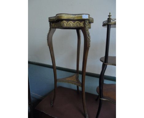 French tripod table, 2 tier with gated top and additional French features in brass 