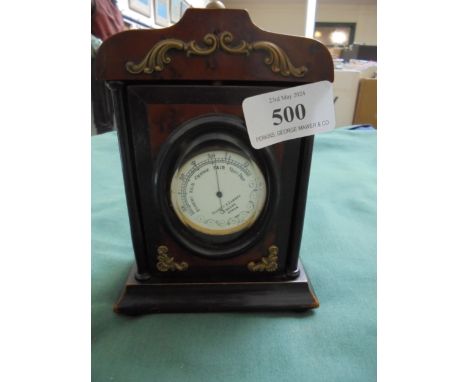 Walnut and ebony watch stand with revolving entry door and beveled glass containing a Negretti and Zambra barometer for repai