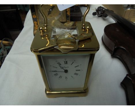 Modern brass carriage clock by Angelus (with key)