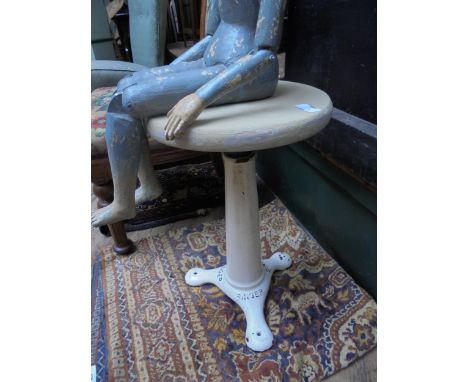 Industrial metal machinist stool with revolving top, tripod base marked Singer