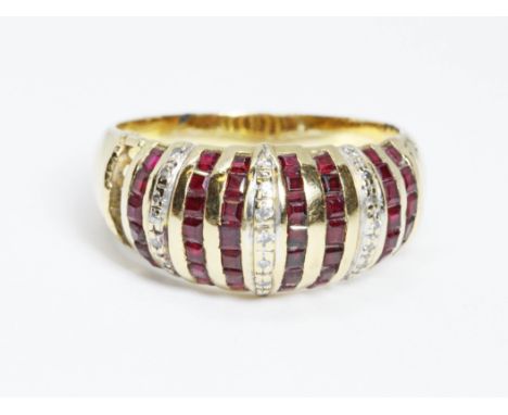 A ruby and diamond ring, marked '750', gross weight 6.5g, size O.  Condition - a line of stones missing, general wear.