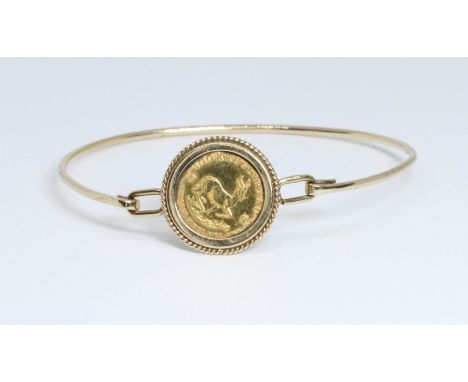 A 1982 1/10th Krugerrand bangle, partial hallmark for Sheffield, diameter 5.5cm, gross weight 7.8g.  Condition - good, genera