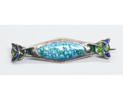 An Arts &amp; Crafts silver enamel brooch by James Fenton, Birmingham 1910, length 39mm, gross weight 3.7g.  Condition - gene