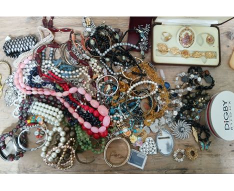 A box of mixed vintage and modern costume jewellery.  