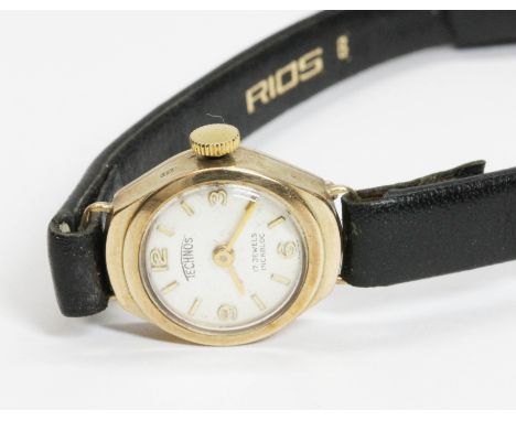 A ladies 9ct gold Technos wristwatch with leather strap.  