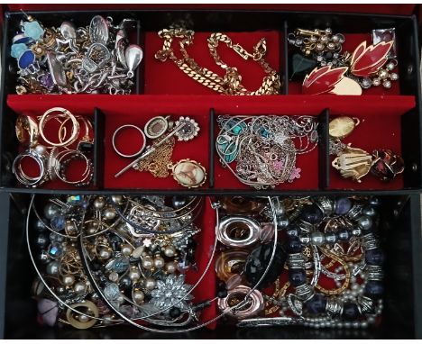 A black cantilever jewellery box containing vintage and mixed costume jewellery.  