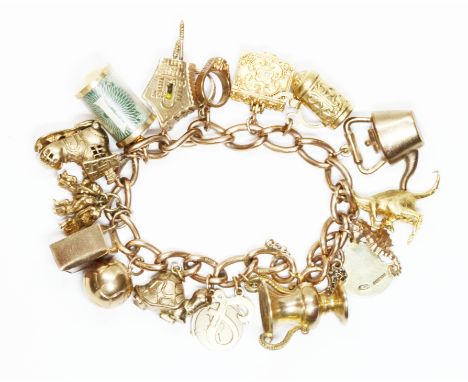 A vintage charm bracelet, seventeen hallmarked 9ct gold charms, the links marked '9.375', length 17cm, gross weight 68.2g.  C