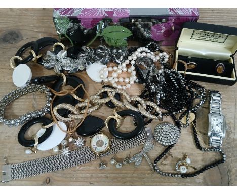 A glass jewellery box and contents including a bracelet marked '925', costume jewellery including a Pierre Cardin bracelet, a