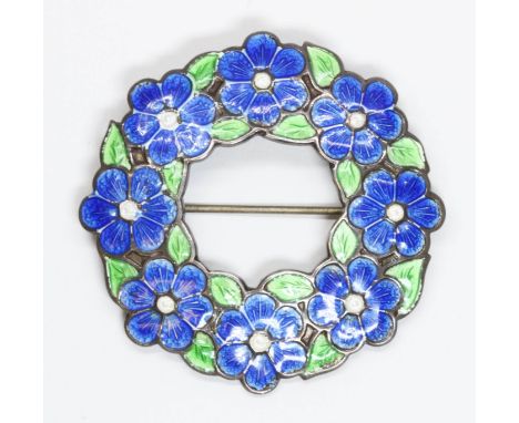 A silver and enamel brooch of wreath form, hallmarked; sponsor 'A.H.D&amp;S' (Alfred Horatio Darby), Birmingham 1944, diamete
