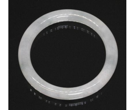 A Chinese icy jadeite jade bangle, inner diameter 55mm, outer diameter 74mm, gross weight 44.4g. Condition - good, little wea