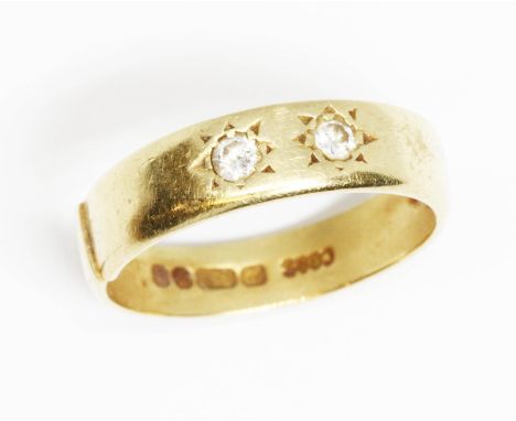 A hallmarked 18ct gold two stone diamond ring, gross weight 3.7g, size K.  Condition - band cut, general wear.