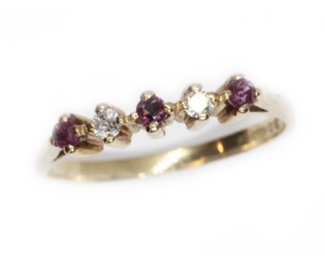 A hallmarked 9ct gold diamond and ruby ring, gross weight 1.5g, size M. Condition - good, minor wear only.