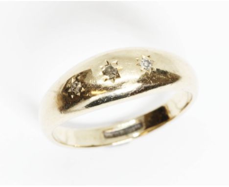 A hallmarked 9ct gold three stone diamond ring, gross weight 2.5g, size K.