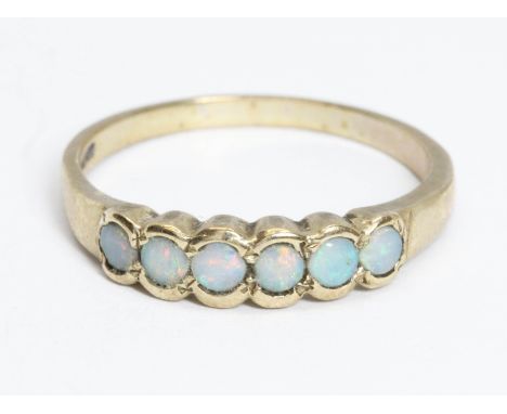 An opal cabochon ring, 9ct gold convention marks, gross weight 2.6g, size S.