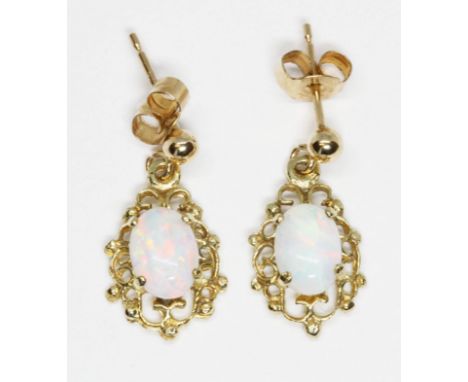 A pair of opal cabochon earrings, marked '375', drop length 17mm, gross weight 1.1g.