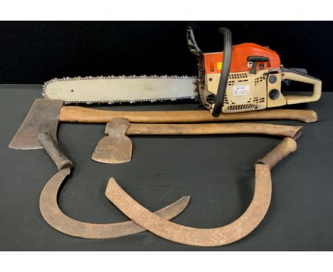 A petrol MT-9999 chainsaw, two sickles, two axes (5) 
