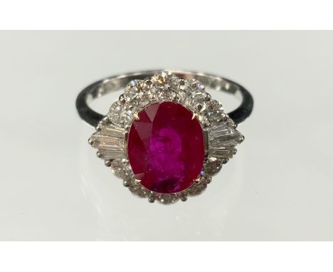 A certified ruby and diamond ring, central oval mixed cut ruby, 2.05ct, surrounded by sixteen round brilliant cut diamonds, t