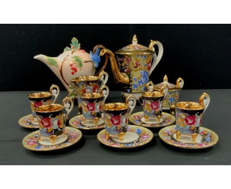 A Capodimonte Italian porcelain Coffee set, for six, decorated with flowers on a black ground, inc coffee pot, sugar bowl, ju