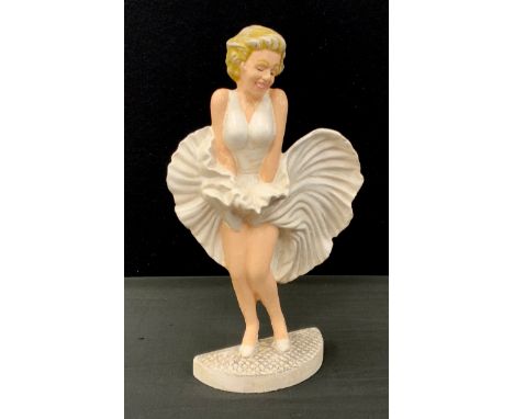 A cast iron door porter of Marilyn Monroe, 34cm high 