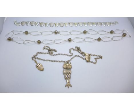 Three necklaces; a panelled choker, a necklace with faceted beads and one other with articulated owl pendant