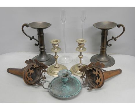 A collection of candlesticks, a pair of Tudor style wall mounted candlesticks, a pair of silver plated candlesticks, a pair o
