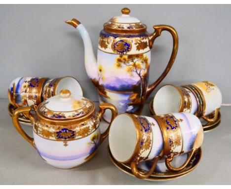 An oriental tea service, Noritake part coffee service and Fuji china tea ware in black and gilt
