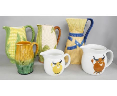 A collection of four wheat and corn style jugs including one Shorter &amp; Son Staffordshire together with two Finnish Arabia