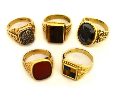 Four gents 9ct H/M rings to include carnelian set etc, approx gross weight 30.9gms, together with a gents ring stamped 10k, a