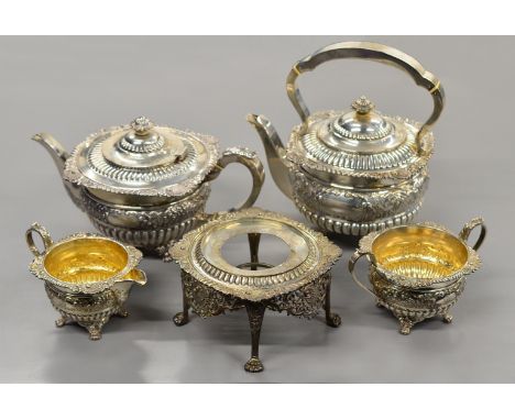 A late Victorian five piece silver tea-set with kettle &amp; stand, embossed &amp; fluted decoration with gilded interior to 