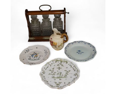 An oak three bottle tantalus, with key, together with three 18th/19th century faience plates and a Royal Worcester jug, tanta