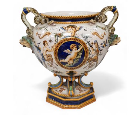 A large Ginori maiolica two handled pedestal vase, 34cm from base to top of handles