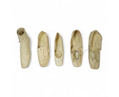 A 19th century hand made cream kid leather ladies ankle boot and four differing cream silk and satin single wedding shoes. Al