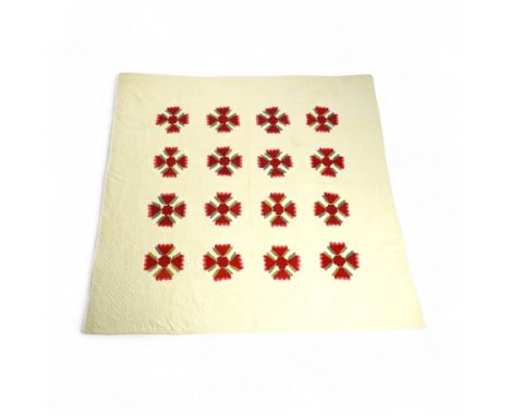 An American quilt from Kentucky, circa 1900. Intricately hand quilted on a white ground, appliquéd with stylistic repeating f