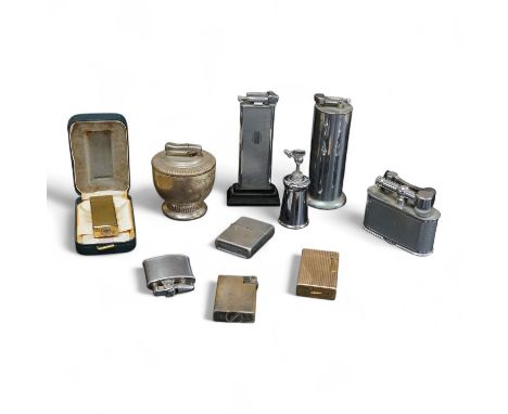 Ten assorted lighters including two Dunhill examples, a Ronson and Dupont, largest 12cm high
